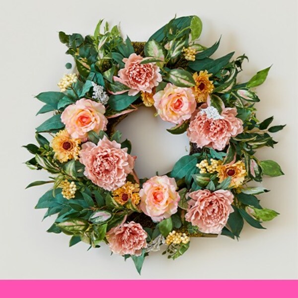 green wreath with pink and yellow flowers